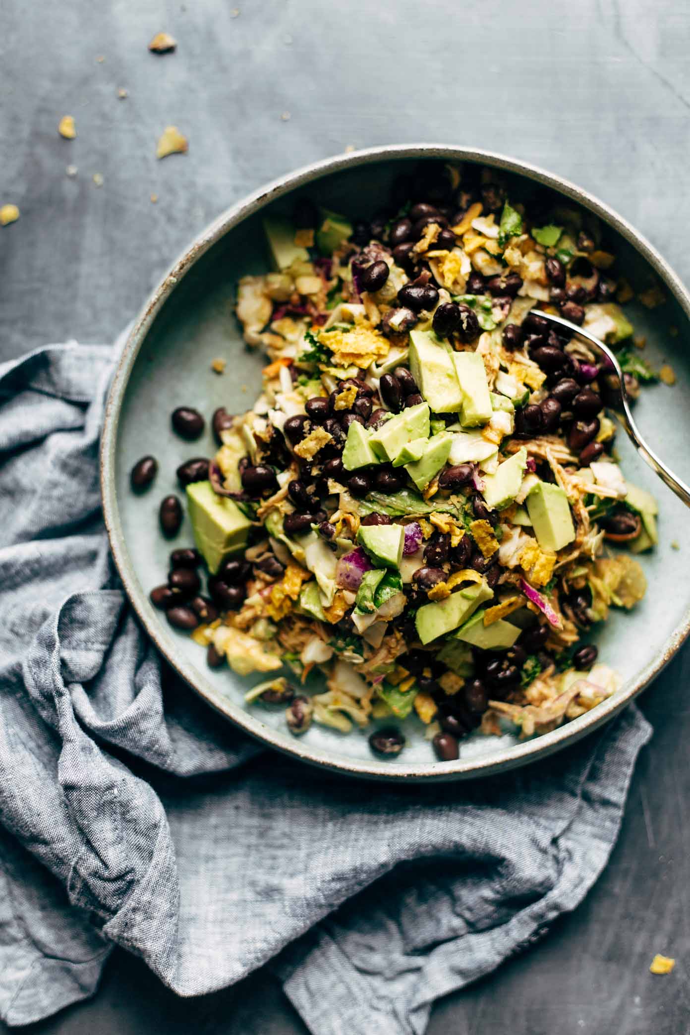 Cheater's Power Salad - kale, cabbage, avocado, green onion, cilantro, black beans, crispy onions, tortilla strips, chicken, and BBQ ranch dressing, made from a salad mix! I KNOW. perfect for easy lunches! | pinchofyum.com