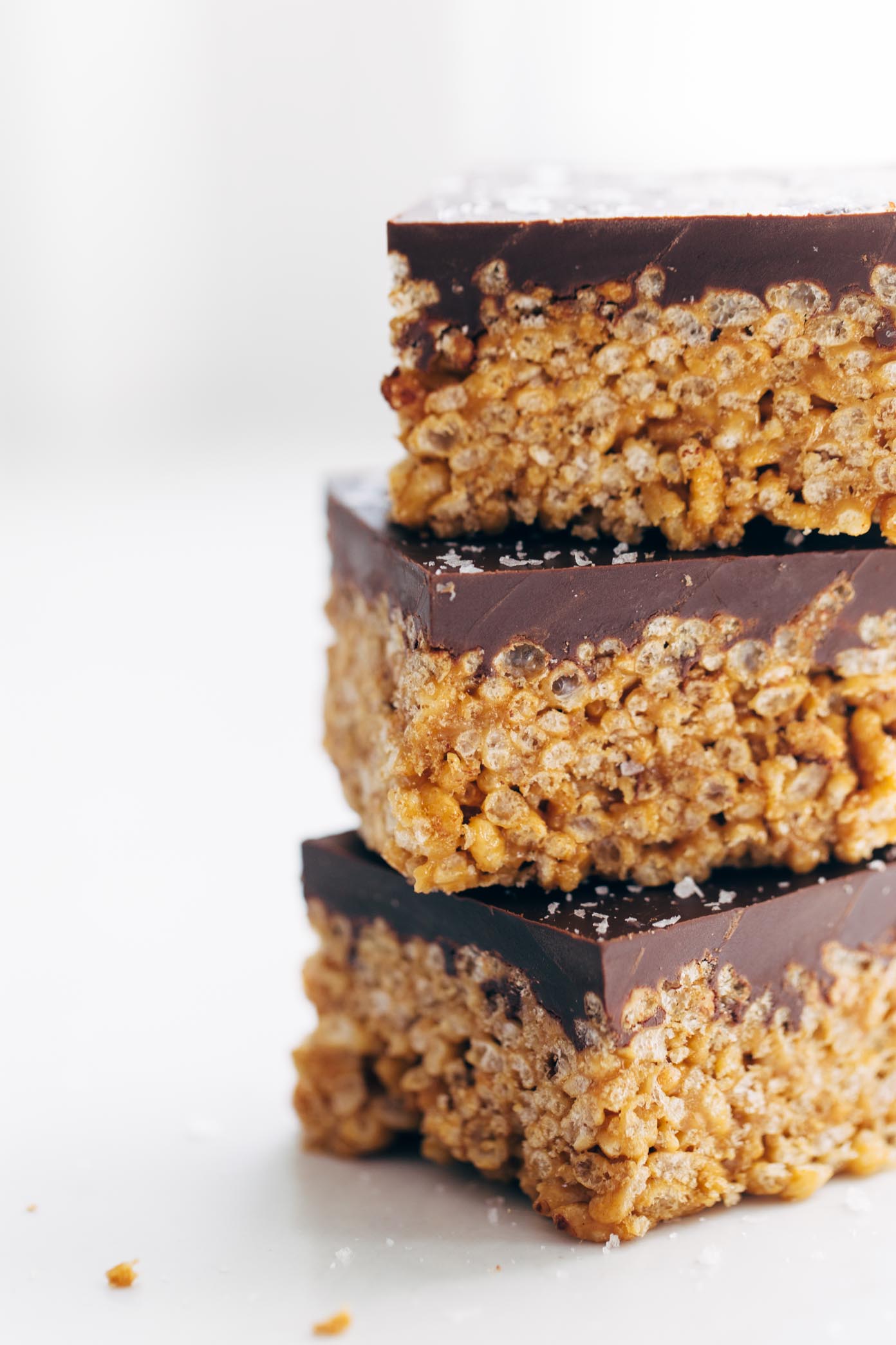 The classic chocolate-covered peanut butter rice krispie bars --> with 5 ingredients and minimal refined sugar, thanks to a few modern swaps! my go-to for road trip snacks. | pinchofyum.com” width=”600″ height=”900″ srcset=”http://hueysrestaurant.com/wp-content/uploads/2017/09/Modern-Scotcheroos-5.jpg 1392w, http://cdn.pinchofyum.com/wp-content/uploads/Modern-Scotcheroos-5-200×300.jpg 200w, http://cdn.pinchofyum.com/wp-content/uploads/Modern-Scotcheroos-5-768×1152.jpg 768w, http://cdn.pinchofyum.com/wp-content/uploads/Modern-Scotcheroos-5-600×900.jpg 600w” sizes=”(max-width: 1392px) 100vw, 1392px”></p>
<p>Sticky-sweet, lightly crispy peanut butter rice krispie mixture topped with a thick layer of melted chocolate and sprinkled with magical flakes of sea salt. That’s all, thank you and goodnight Twin Cities!</p>
<p>Friends, this is the food I was raised on. In the background of every family and school event of my childhood lies a scratched and dented 9×13 of almost-gone scotcheroos. It is simple Midwestern goodness and it should not be messed with.</p>
<p>Except, I did one thing: I messed with it. Whyyyy.</p>
<p>As an anxious person finding her way through the world, I’d say I follow all rules of all places at all times exactly ALL THE TIME, but there is always that pesky 1% of the time at which point I become a rule-breaking, delinquent, rogue recipe “creative.” It is not wise to give me your classic recipes. I am not to be trusted with such precious, unbreakable things. I pinky promise I will take what is written and go off the rails with it.</p>
<p><img class=