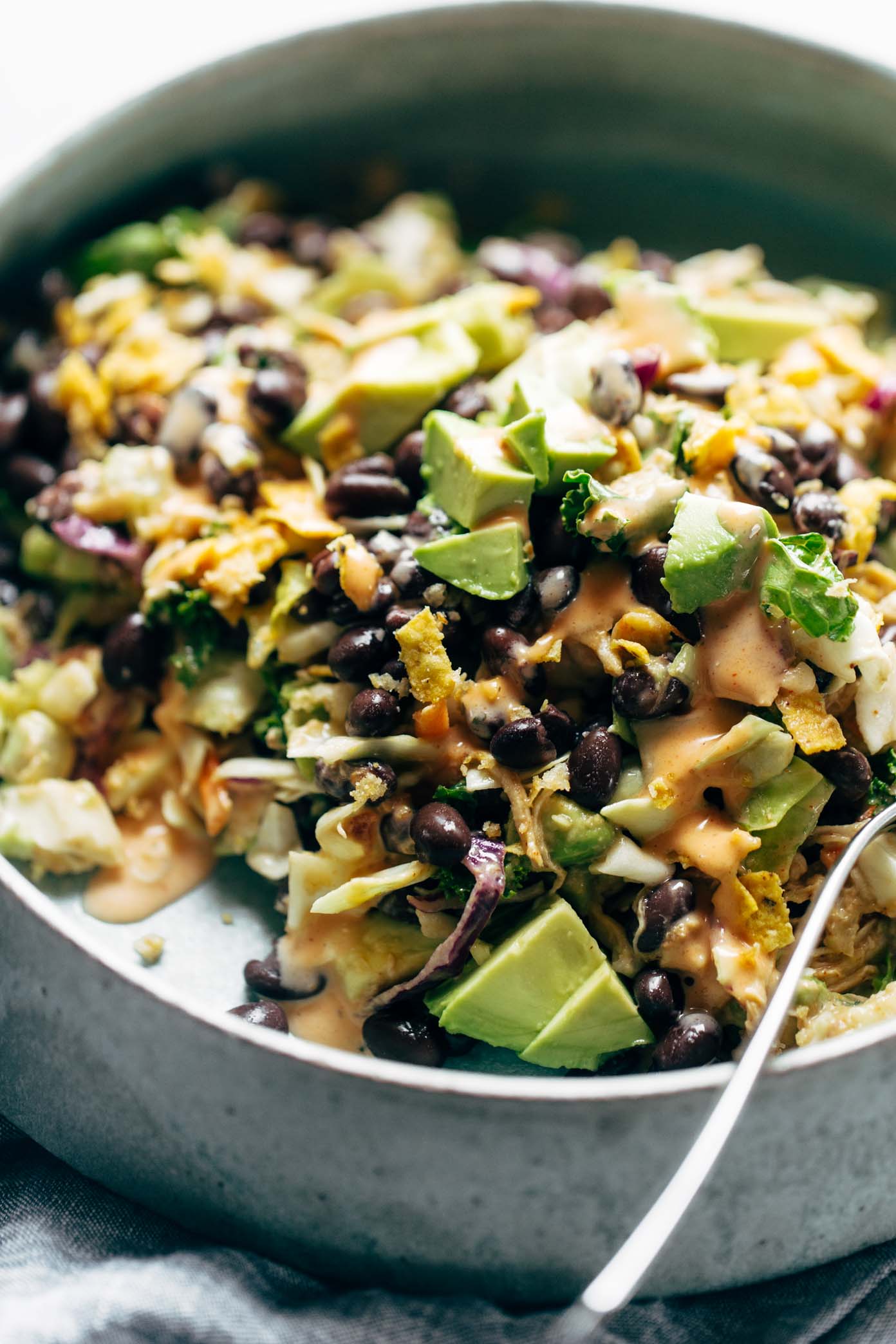 Cheater's Power Salad - kale, cabbage, avocado, green onion, cilantro, black beans, crispy onions, tortilla strips, chicken, and BBQ ranch dressing, made from a salad mix! I KNOW. perfect for easy lunches! | pinchofyum.com